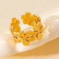 Detailed macro view of golden stainless steel open ring with intricate floral patterns - Five-petal Flower Brushed Texture (#0226)