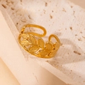 Detailed macro view of adjustable golden olive leaf ring on natural stone texture - Olive Leaf Dotted Style (13) / Gold