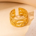 Detailed macro view of a gold-plated adjustable ring featuring leaf-shaped cutout design - Hollow Leaf Style (BJGR0260)