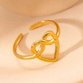 Detail of a golden open ring featuring a heart and infinity symbol hollow design - Heart Infinity Symbol (#0228)