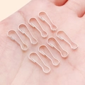 Silver metal calabash pins held in hand to show size for DIY jewelry making - 6x16mm / Bright Silver
