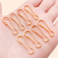 Polished gold pear-shaped iron gourd buckles in palm for DIY jewelry crafting - 8.5x27mm / Gold