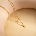 Gold-plated double-layer necklace featuring a heart charm and letter E pendant - Letter E