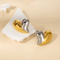 Detailed view of 18K gold plated heart stud earrings with two-tone mirror finish - Two-Tone 3D Heart Style (#0121H)