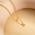 Double-layered 18K gold plated stainless steel necklace featuring letter H and heart charm - Letter H
