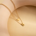 Double layered gold-plated stainless steel necklace with heart and letter R pendants - Letter R