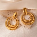 Close-up of gold double-layer geometric oval earrings with a polished mirror finish - Golden Double Nested Circle Earrings (BJGE1034)