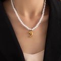 Detail shot of a refined 18K gold-plated dolphin pendant with elegant white pearls - Artificial Pearl Dolphin (BJGN0398)