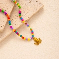 Macro view of Bohemian rainbow seed bead necklace with gold octopus metal pendant - Octopus Pendant (#0390)
