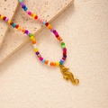 Detail of colorful rainbow beads necklace with a textured golden seahorse charm - Seahorse Pendant (#0388)