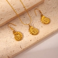Detailed view of golden nautilus shell jewelry set on travertine stone background - Conch Set