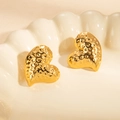Gold heart stud earrings with hammered texture displayed in a ceramic tray - Granular Heart Style (BJGE0838)