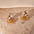 Elegant gold heart earrings with three cascading pearls on a textured stone surface - Artificial Pearl Heart (BJGE1042)