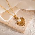 Close-up of a gold pearl pendant necklace on a premium textured silk background - Semi-circular Radiant Line Style (JJN0076)