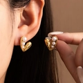 Macro shot of gold heart earrings with gradient white pearls and polished mirror finish - Asymmetric Heart Gradient Pearl Stud (#1042)
