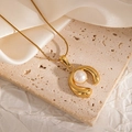 Detail view of 18K gold plated pearl pendant on fine snake chain over soft silk background - Sleek Streamlined Style (JJN0072)