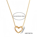 Detail view of gold heart necklace showing dimensions 41cm plus 5cm and 1.7cm width - Gold