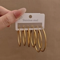 Set mit 3 Paaren polierten goldenen Edelstahl-Creolen in verschiedenen Größen - Oval-Form