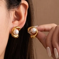 Elegant gold-plated curved pearl earrings shown on model for a sophisticated look - Wrap-around Curve Pearl Earring (#1011)