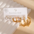 Detailed macro view of 3-piece stainless steel earring set with gold hoops and zircon studs - Beaded Hoop Style(BJGE1379)