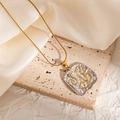 Macro view of abstract square pendant with gold curves on textured steel - Abstract Rounded Square (JJN0168)