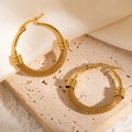 Polished gold-plated hoop earrings featuring intricate woven texture and snap closure - Metal Woven Texture Hoop (#1224)