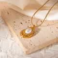 Detail of a 18k gold plated necklace featuring a teardrop pearl pendant on a silk fabric - Teardrop Wave Edge Style (JJN0081)