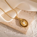 Detail of 18k gold plated necklace with oval textured pendant and white pearl - Double-layer Oval Radiant Style (JJN0083)