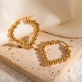 Elegant 18k gold-plated beaded heart-shaped hoop earrings for women shown on stone - Heart Beaded Hoop (#1234)