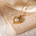 Detail of vintage heart pearl pendant necklace with 18K gold plated molten texture frame - Vintage Lava Pattern Heart Shape (JJN0085)