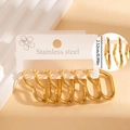 Three pairs of gold wavy heart-shaped stainless steel earrings on a display card - Wave Heart Hoop Set (#1268)