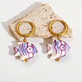 Detail of colorful ceramic fish earrings with blue and purple enamel on gold hoops - Purple Fish