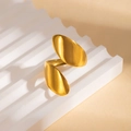 Detailed shot of golden irregular curved open ring on a wavy decorative pedestal - Flat Oval Leaf Style (BJGR0927)
