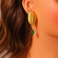 Gold-plated honeycomb drop earrings with green marquise gemstone on fashion model - Gold Spiral Cocoon With Green Gemstone Style (E1691)