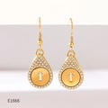Detail of gold-plated drop earrings featuring a crystal-encrusted letter T pendant - Alphabet T Earrings (E1666)