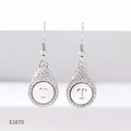 Detail of silver drop earrings with crystal pavé edges and an engraved letter T - Alphabet T Earrings (E1670)