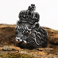 Macro shot of a vintage lion king ring with crown on textured bark background - US 7 / Steel