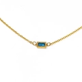Detail of a minimalist gold O-chain necklace featuring a rectangular blue zircon pendant - Gold Blue Stone