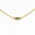 Macro detail of gold necklace featuring a rectangular teal zircon pendant in beaded bezel - Gold Aqua Blue Gemstone