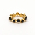 Macro detail of wave patterned gold ring with black crystals and vertical engravings - US 6 / Gold (Black Rhinestone)