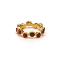 Detailed view of irregular gold ring set with sparkling circular red rhinestones - US 6 / Gold (Pomegranate Red Rhinestone)