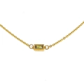 Macro detail of gold necklace with rectangular green gemstone and beaded border - Gold Olive Green Gemstone