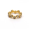 Detail of gold wave-edged ring featuring circular zirconia crystals in a full setting - US 6 / Gold (White Rhinestone)