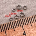 Macro view of 18K gold plated positioning beads in 2mm, 2.5mm and 3mm sizes - 2mm/Aperture 1.3mm - Crimp Beads / White Gold