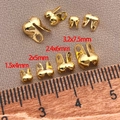 Macro view of 18K gold-plated double-hole clam shell bead tips in four sizes with ruler - 1.5x4mm / 18K Gold