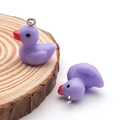 Cute purple resin duck charm for DIY jewelry making with a small silver metal ring - 17x19mm / Purple