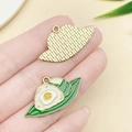 DIY jewelry charm featuring a green and white panda zongzi design with a golden alloy back - Two Zongzi (23034) / 33x18mm