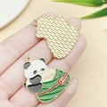 Panda holding zongzi alloy pendant for DIY jewelry, featuring enamel and gold finish - Panda Holding Zongzi (23036) / 31x27mm
