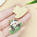 DIY enamel panda charm with bamboo leaf detail and gold finish for jewelry making - Panda Zongzi Boat (23043) / 32x26mm