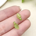 Translucent green acrylic leaf pendant on fingertips for DIY jewelry making - Light Green Mini Leaf Style (21955)